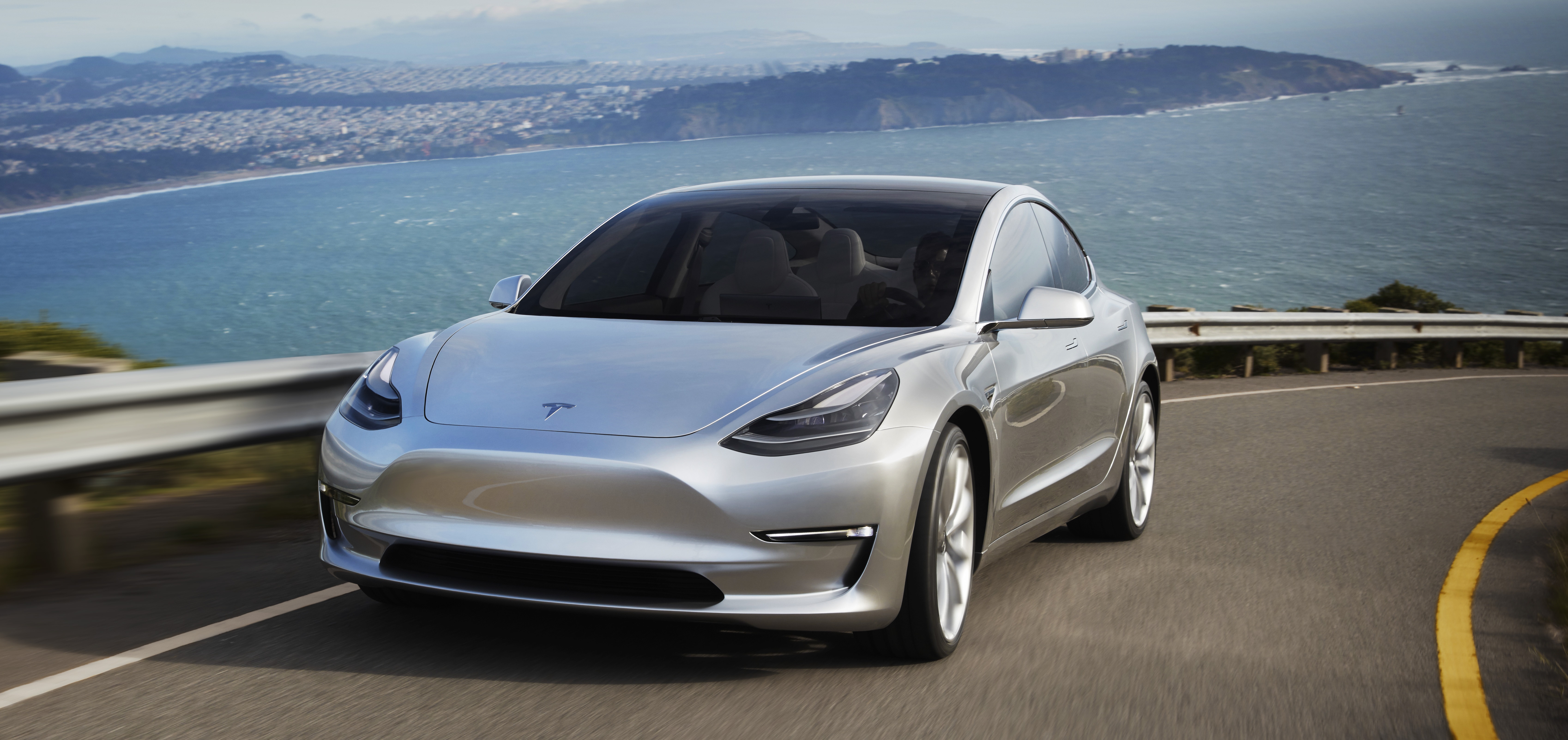 Tesla Model 3 silver prototype promo shot headlands